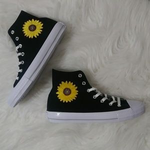 converse with sunflowers